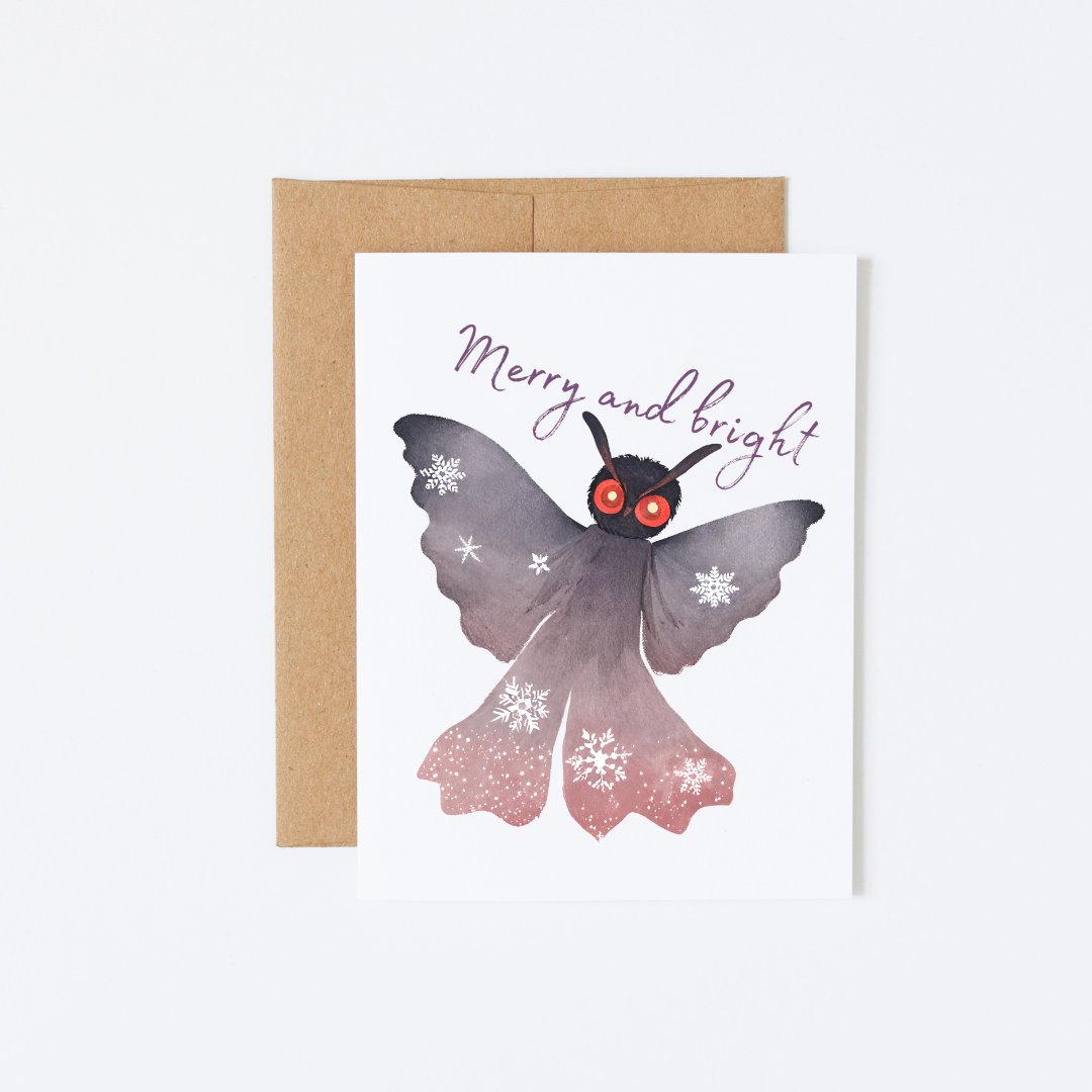 A Christmas card with an illustration of a mothman creature and the message “I came out of my lair to give you this gift”